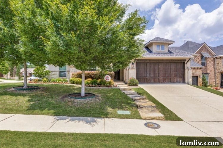Living room with high ceilings, decorative gas fireplace, and views of the private backyard