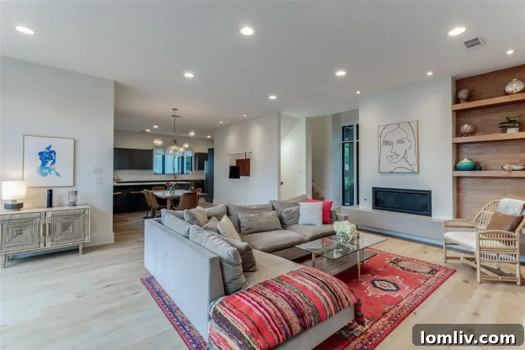 Luxurious living and dining room with built-in bookshelves and gas fireplace at 537 Northlake Drive