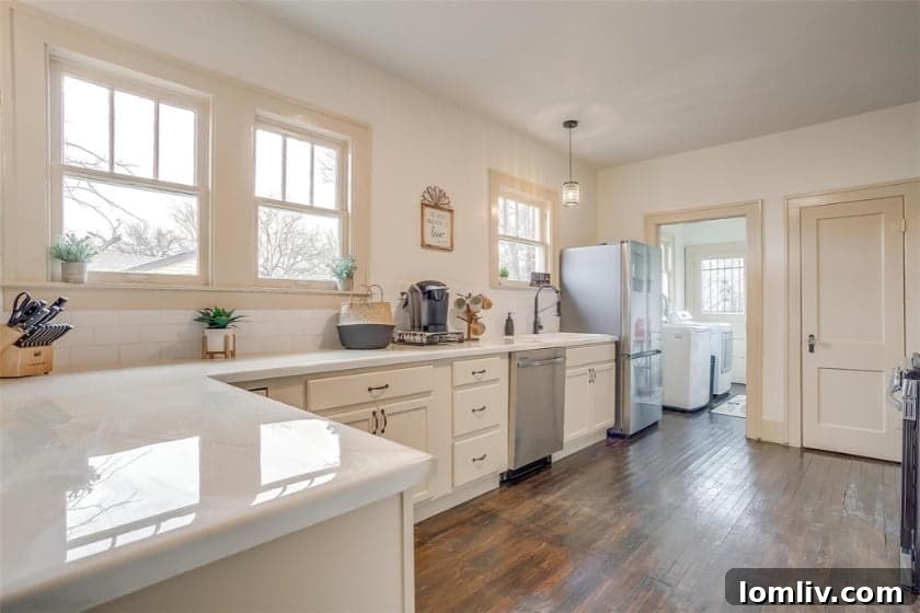 Stylish kitchen and living area in renovated Tudor home