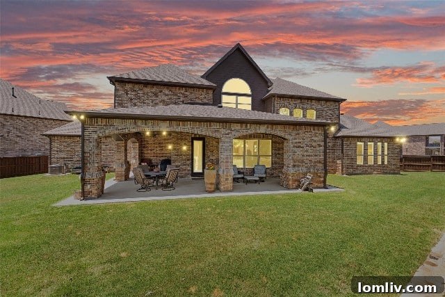 Expansive nearly half-acre backyard with covered patio in luxury Colleyville home