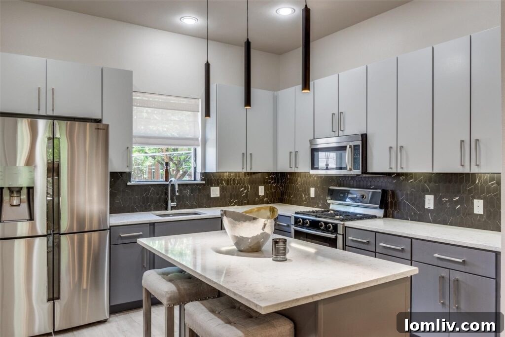 Elegant kitchen with marble countertops and modern appliances in a Dallas condo