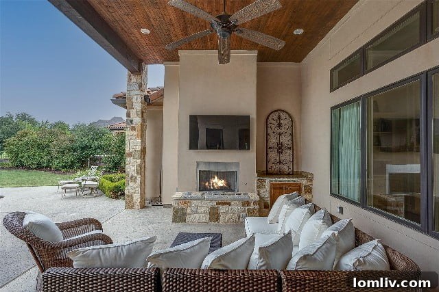 Outdoor living area with fireplace and comfortable seating
