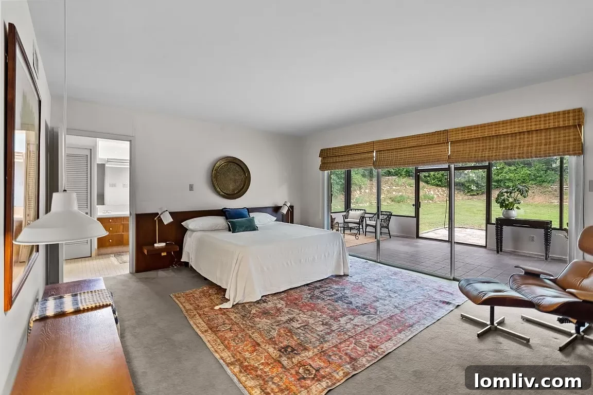 Primary bedroom with original built-in headboard and nightstands, showcasing thoughtful design.
