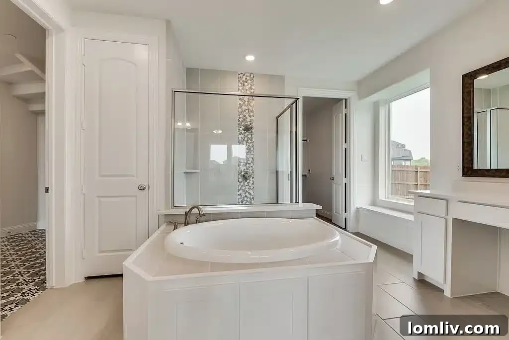 Luxurious primary bedroom suite offering comfort and elegance