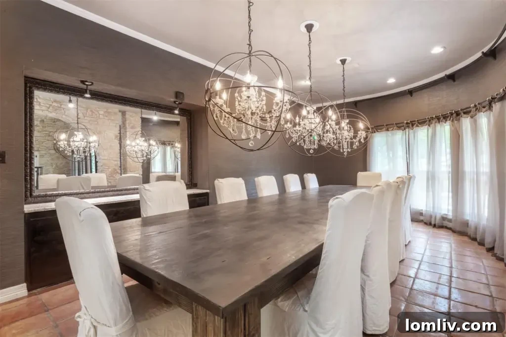 Formal dining room with three chandeliers