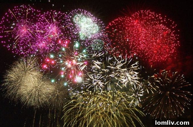 Thousands of drones illuminate the night sky, forming intricate shapes above a celebrating crowd.