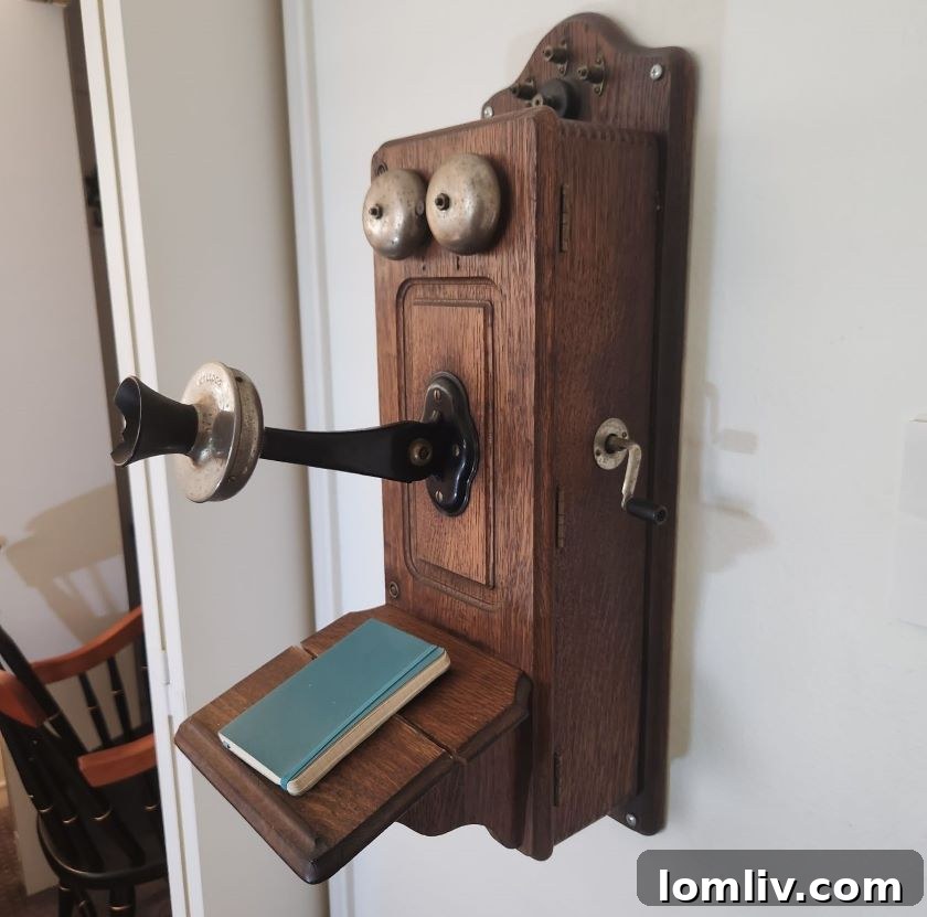 An antique telephone with an unusual, watchful appearance, adding character to a home.