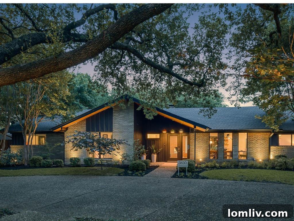 A stunning midcentury modern home with exceptional curb appeal, featuring clean lines, lush landscaping, and a welcoming entrance.