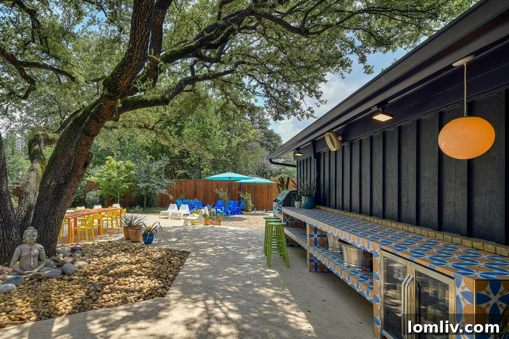 A breathtaking view of the outdoor Zen garden, featuring a large geometric pool, lush landscaping, and mature trees.