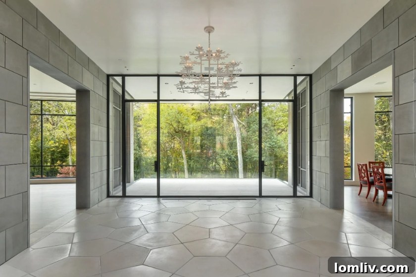 Interior view of 9035 Broken Arrow Lane, showcasing large windows and natural light