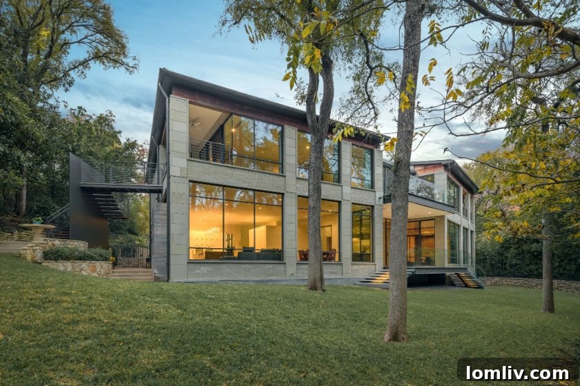 Bedroom with expansive windows offering private views of the landscape