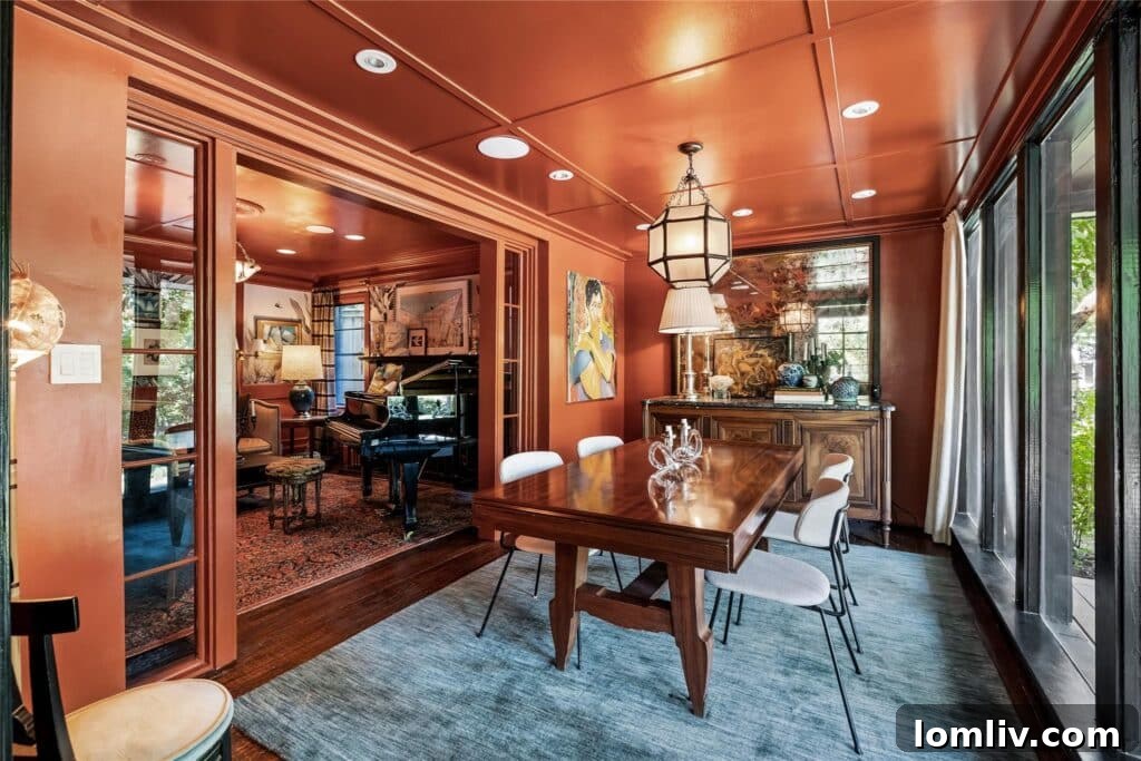 Beckley Club Estates' Reimagined Cottage: The Standard Has Been Raised 4 A sophisticated entryway with a glimpse into a richly colored living room, featuring unique design elements