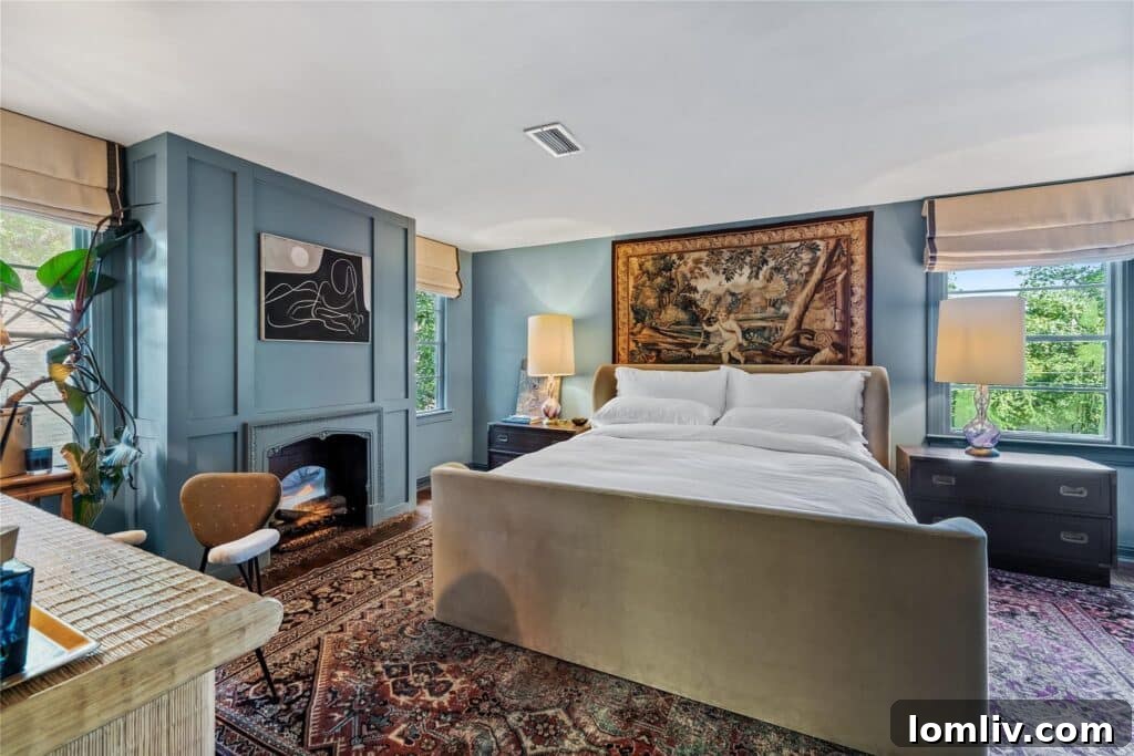 Beckley Club Estates' Reimagined Cottage: The Standard Has Been Raised 5 Spacious kitchen with modern black and olive green cabinetry, a black marble waterfall island, and unique reclaimed windows