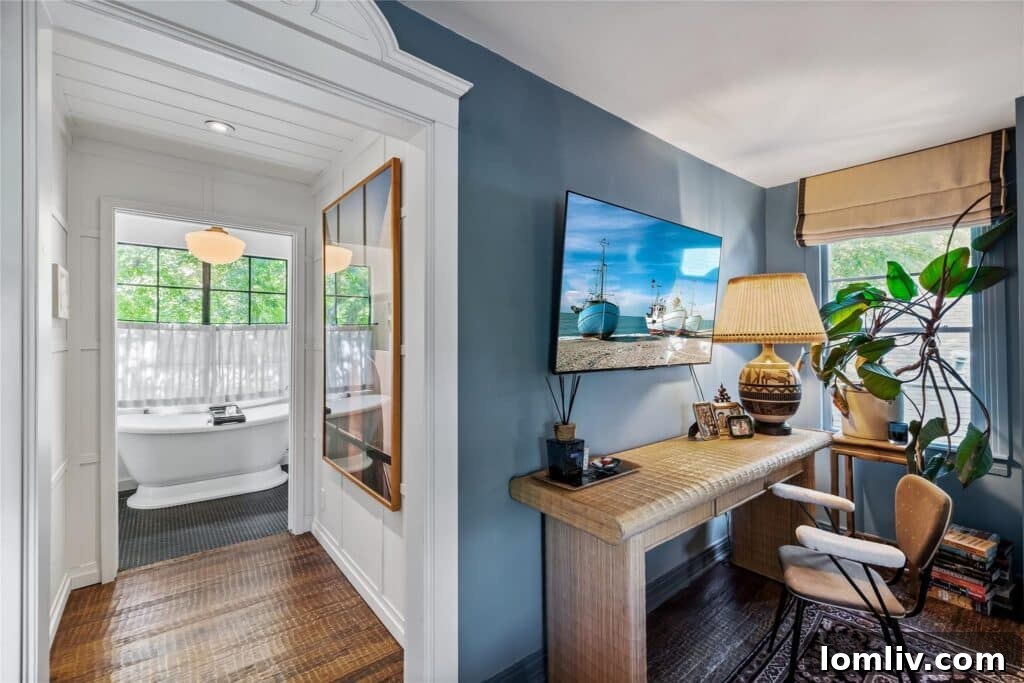 Beckley Club Estates' Reimagined Cottage: The Standard Has Been Raised 6 Detail of the sleek black marble waterfall island in the kitchen, surrounded by modern cabinetry