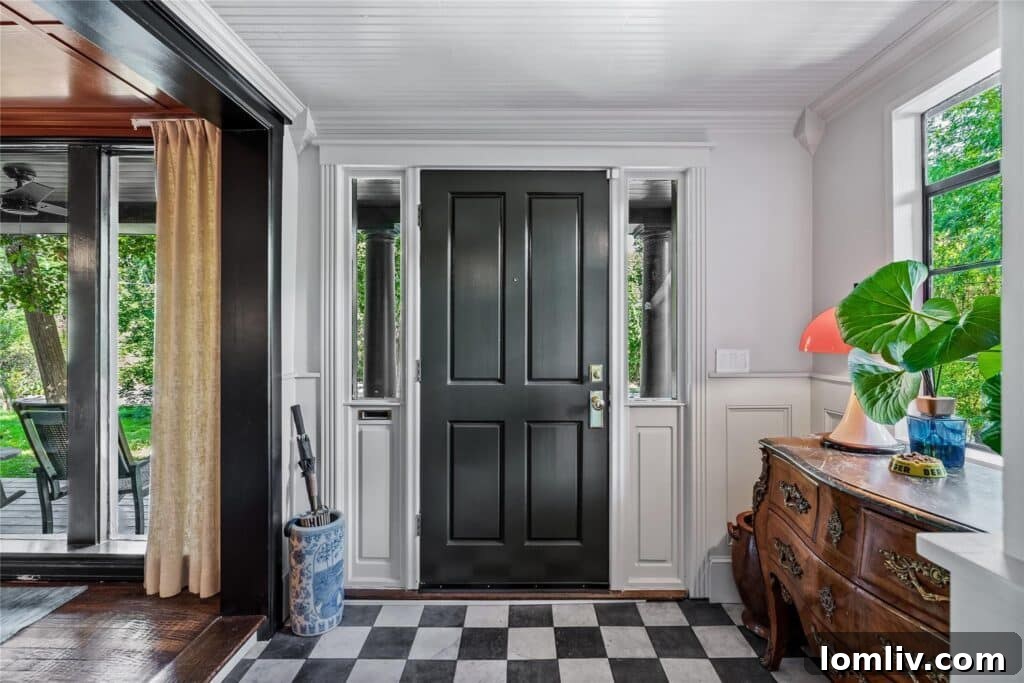 Beckley Club Estates' Reimagined Cottage: The Standard Has Been Raised 8 Vibrant rust-colored living room featuring a sleek black grand piano, unique wallpaper insets, and framed art