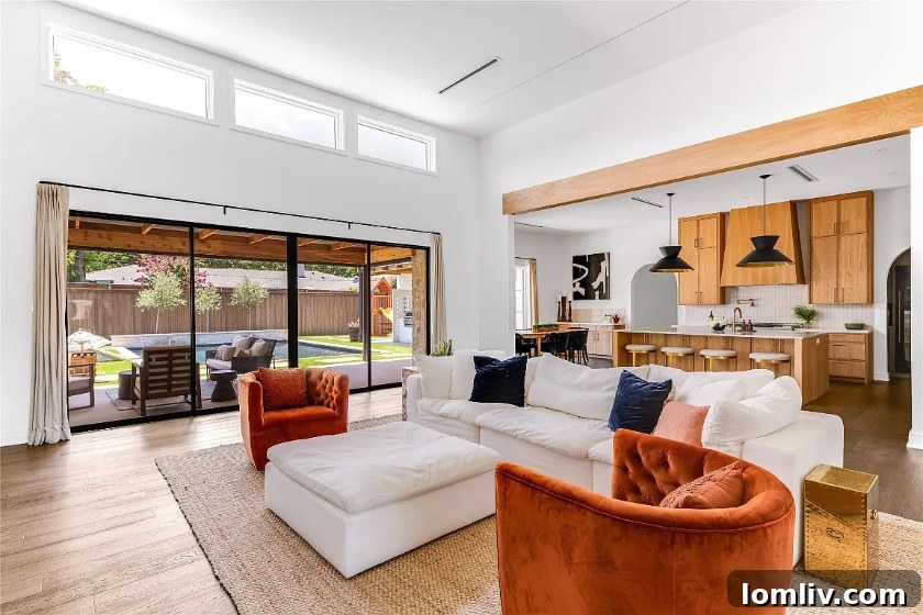 Outdoor living space with pool and covered patio in a Dallas luxury home