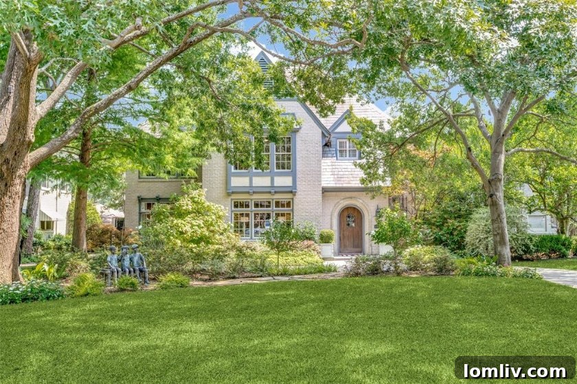 Grand entrance of a historic Tudor home at 3325 Beverly Dr.