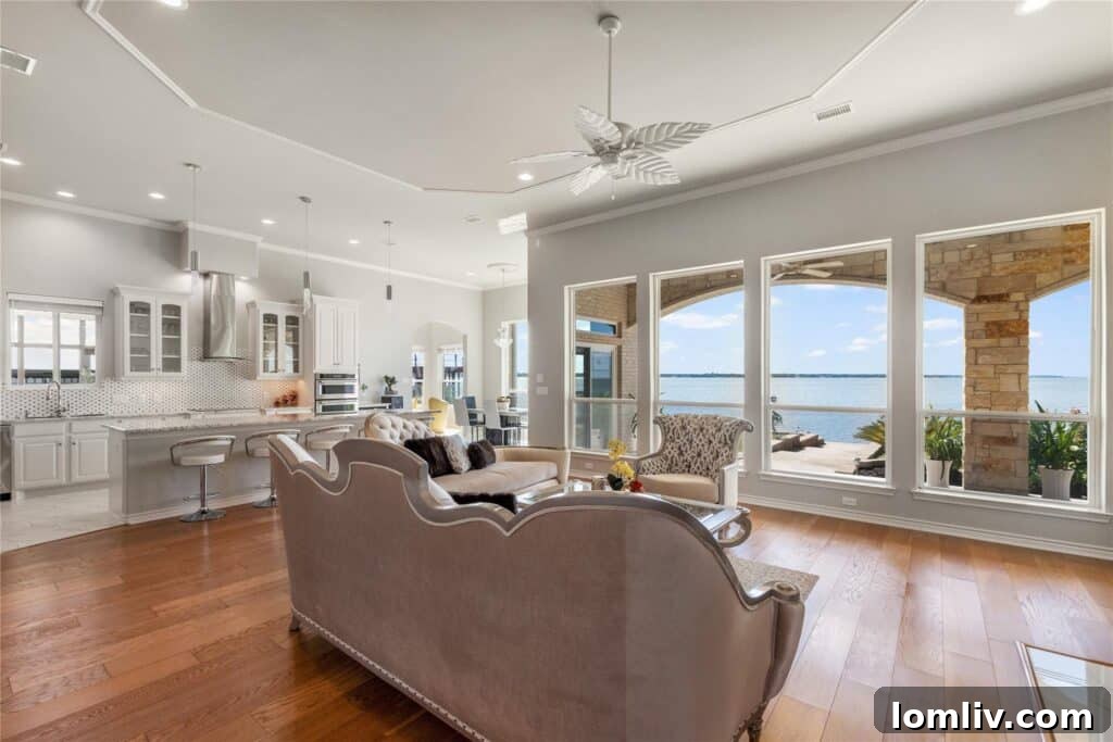 Elegant kitchen with a large island, granite countertops, and modern appliances.