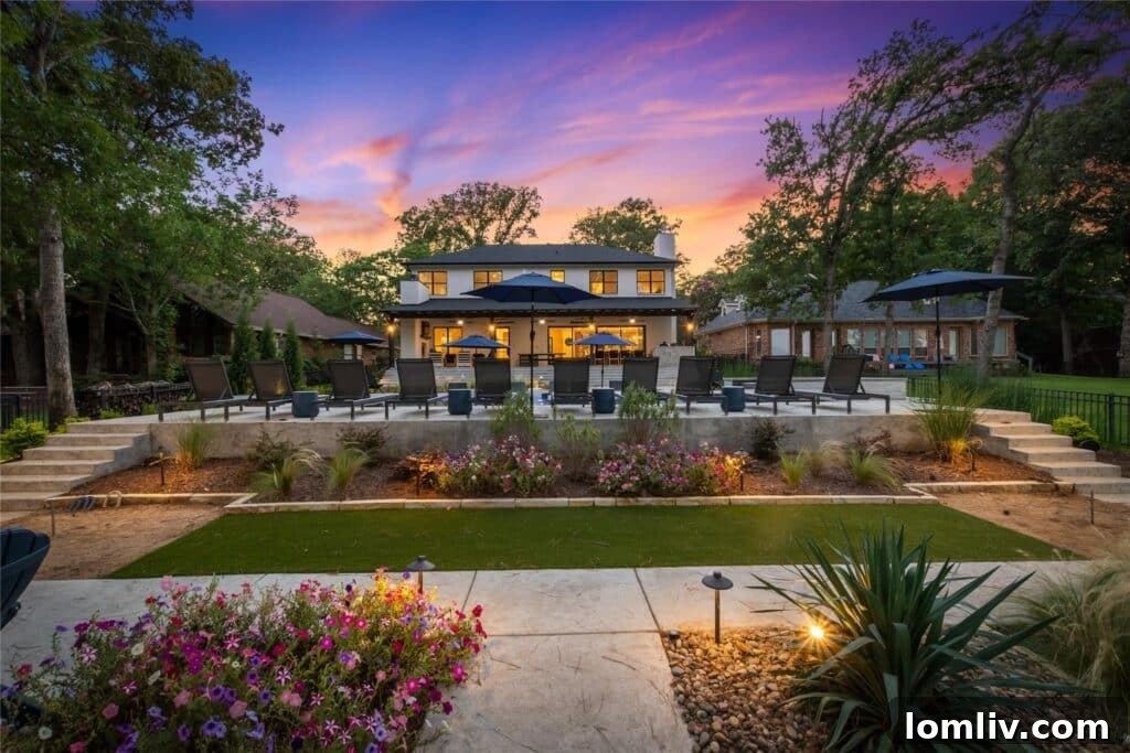 Resort-style backyard with a heated volleyball pool and meticulously landscaped grounds.