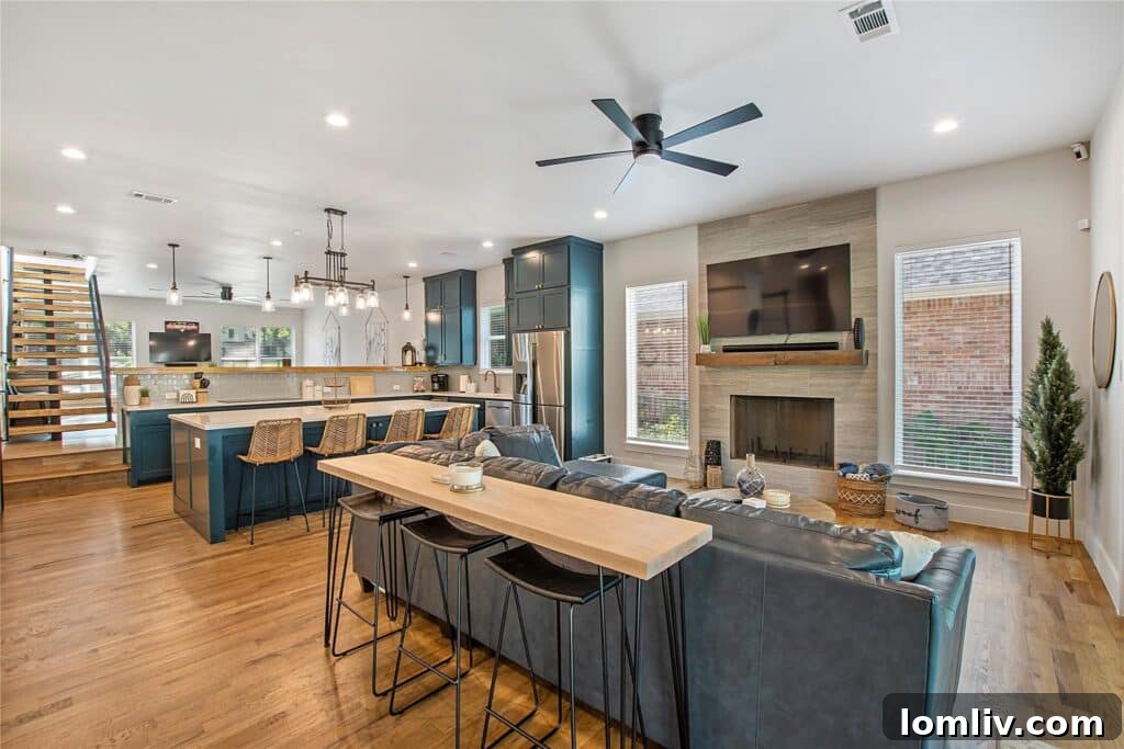 Game room with a fully stocked bar, pool table, and shuffleboard table.