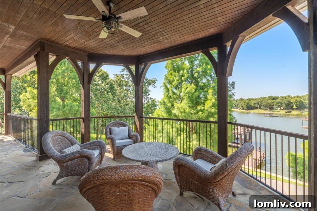 Luxurious boathouse with a sun deck overlooking the expansive lake.