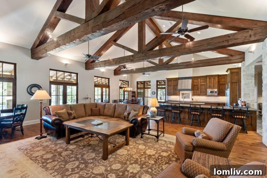 Modern kitchen with soapstone island and high-end stainless steel appliances.