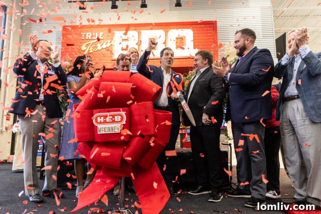 A vibrant aerial shot showcasing the grand opening of the McKinney H-E-B store, surrounded by eager crowds and featuring prominent landscaping.