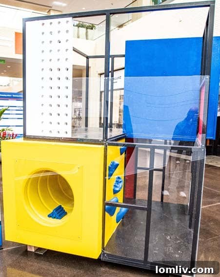 Another view of the Mondrian-inspired 'Kid-Drian' playhouse, highlighting different colored sections and its unique architectural form.
