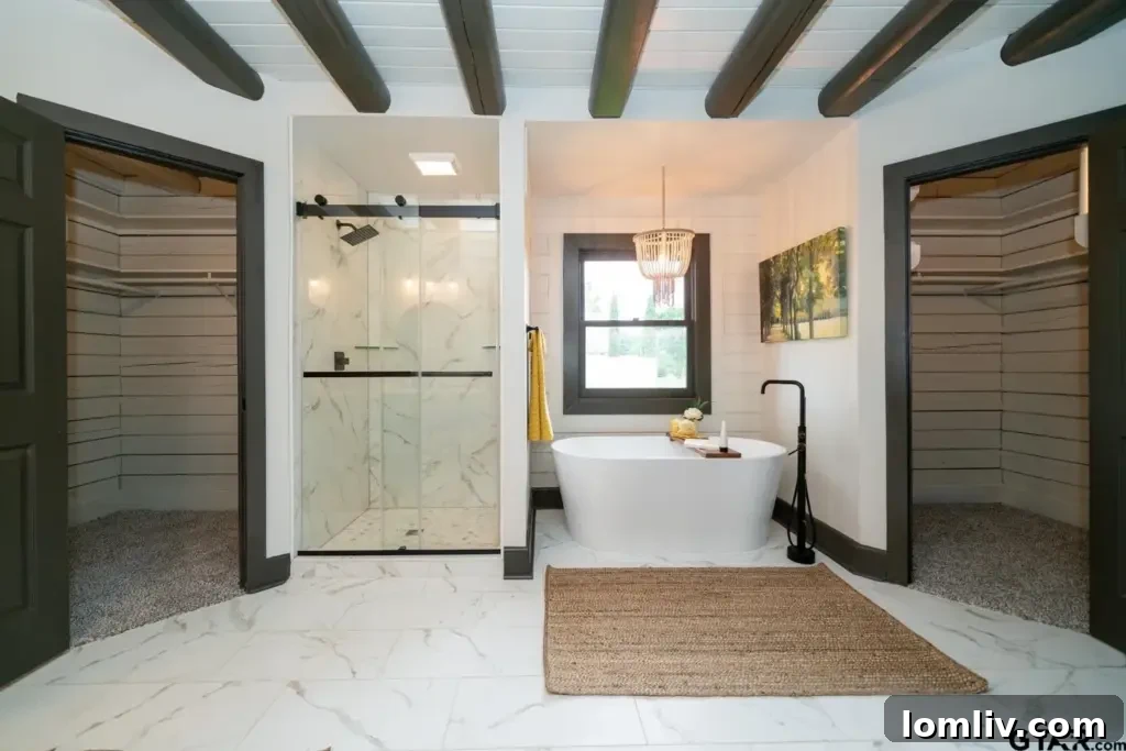 Luxurious primary bathroom with contemporary fixtures and a walk-in shower
