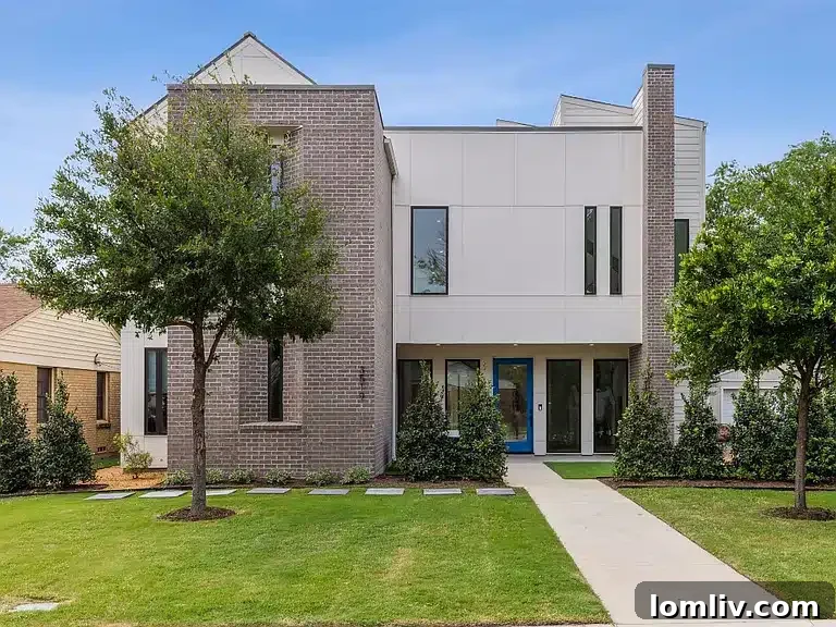 Exterior view of a modern luxury home in Dallas, showcasing contemporary design and landscaping.