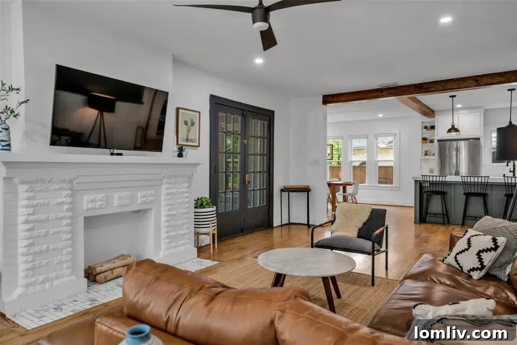An elegant living room with a fireplace, ready for cooler seasons.