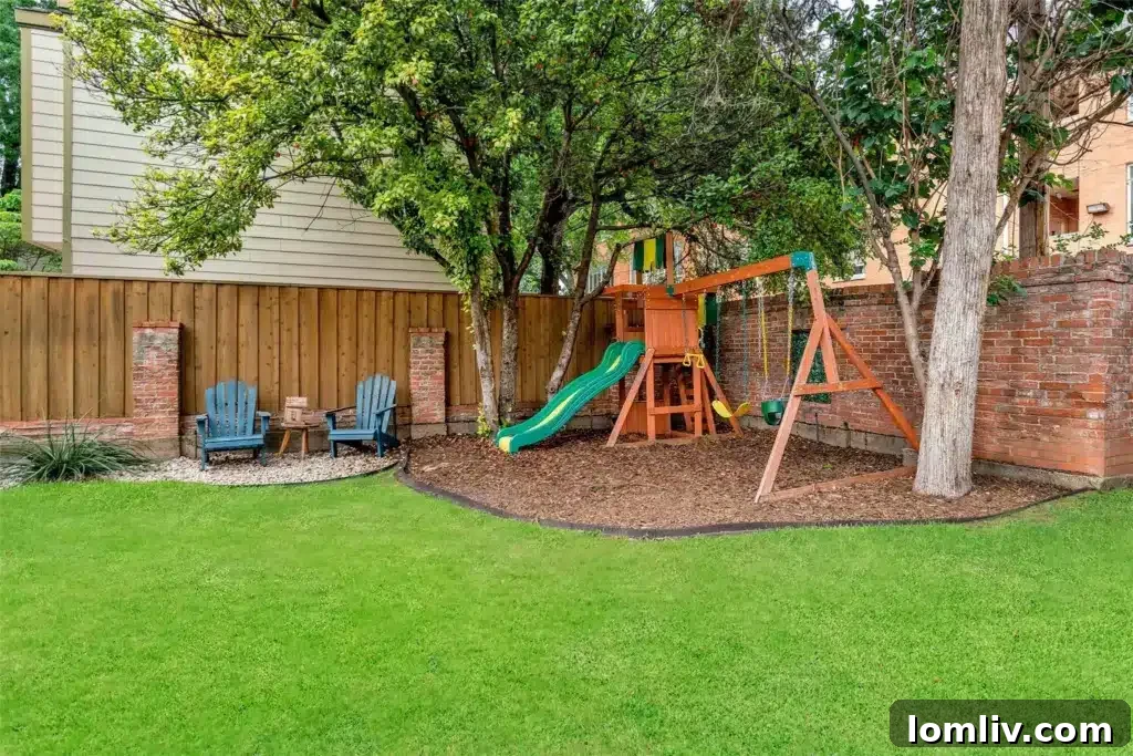 A children's play area in a shaded backyard, surrounded by trees.