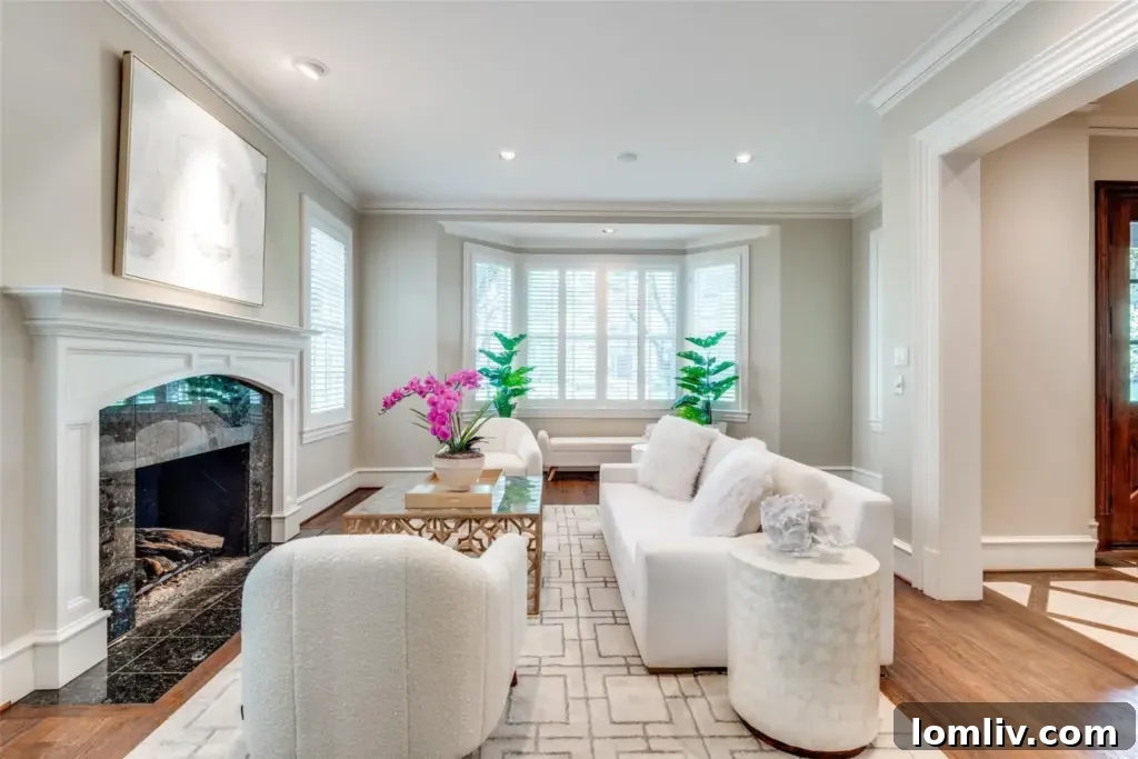 A luxurious living room with a grand fireplace, hinting at winter comforts.