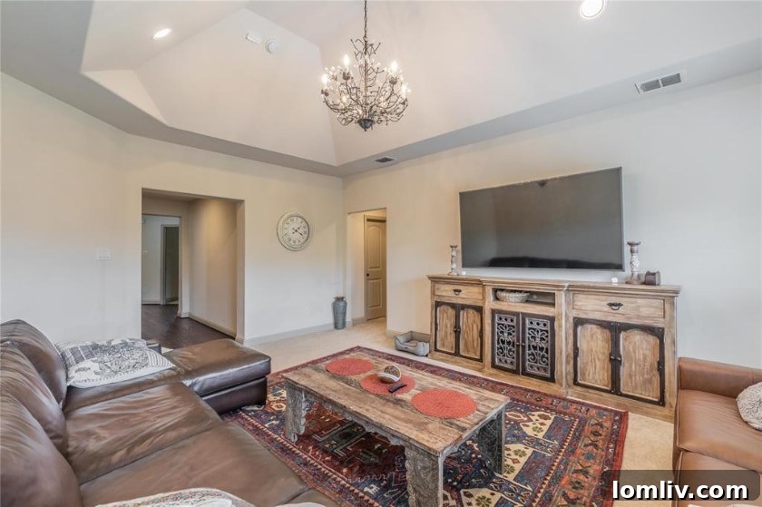 Expansive green backyard of the Las Colinas luxury home, offering plenty of space for outdoor activities.