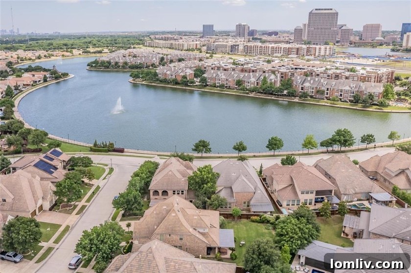 Modern glass corporate buildings in Las Colinas reflecting the clear sky, surrounded by well-maintained landscapes.