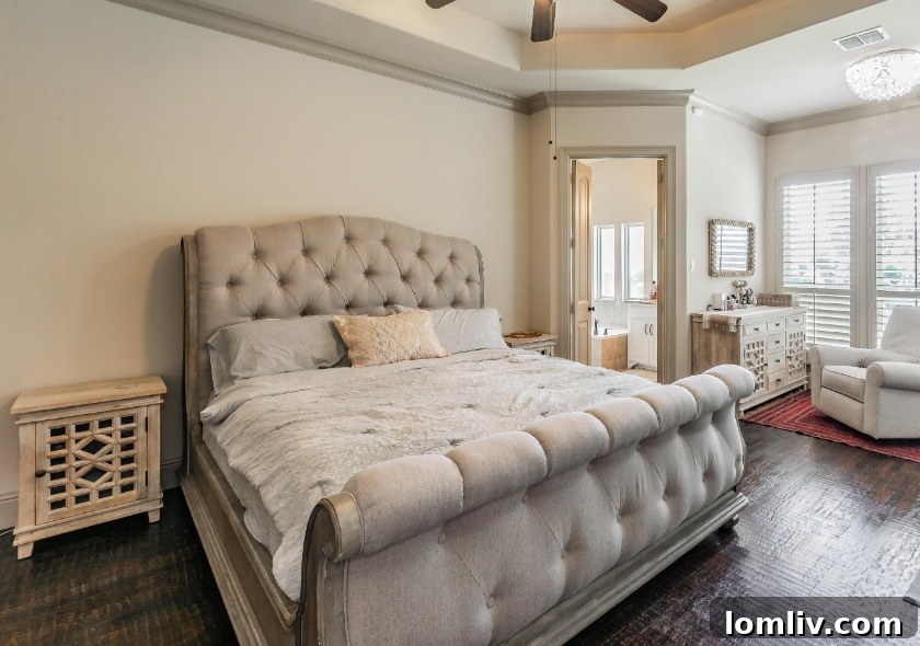 A spacious and comfortable living room with a fireplace and large windows, perfect for relaxation.