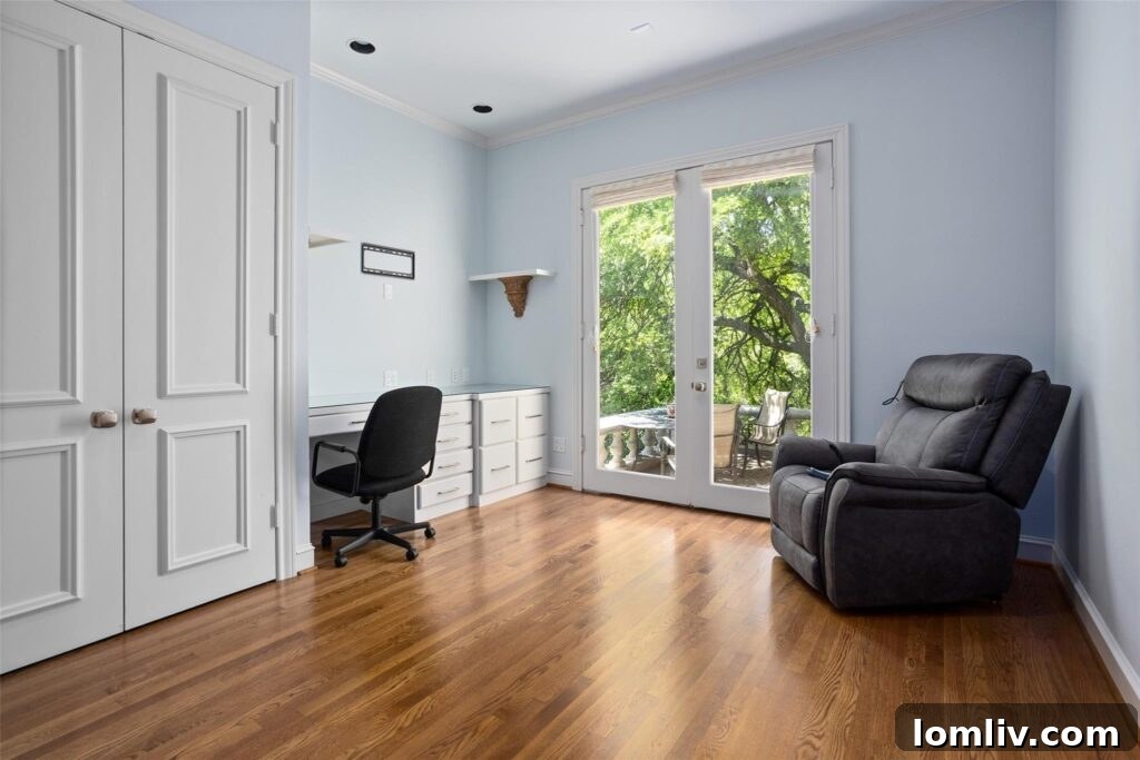 Primary bathroom with marble countertops and elegant finishes