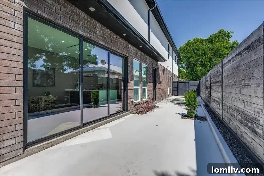 Chic outdoor living area potential in the private courtyard of this Dallas home