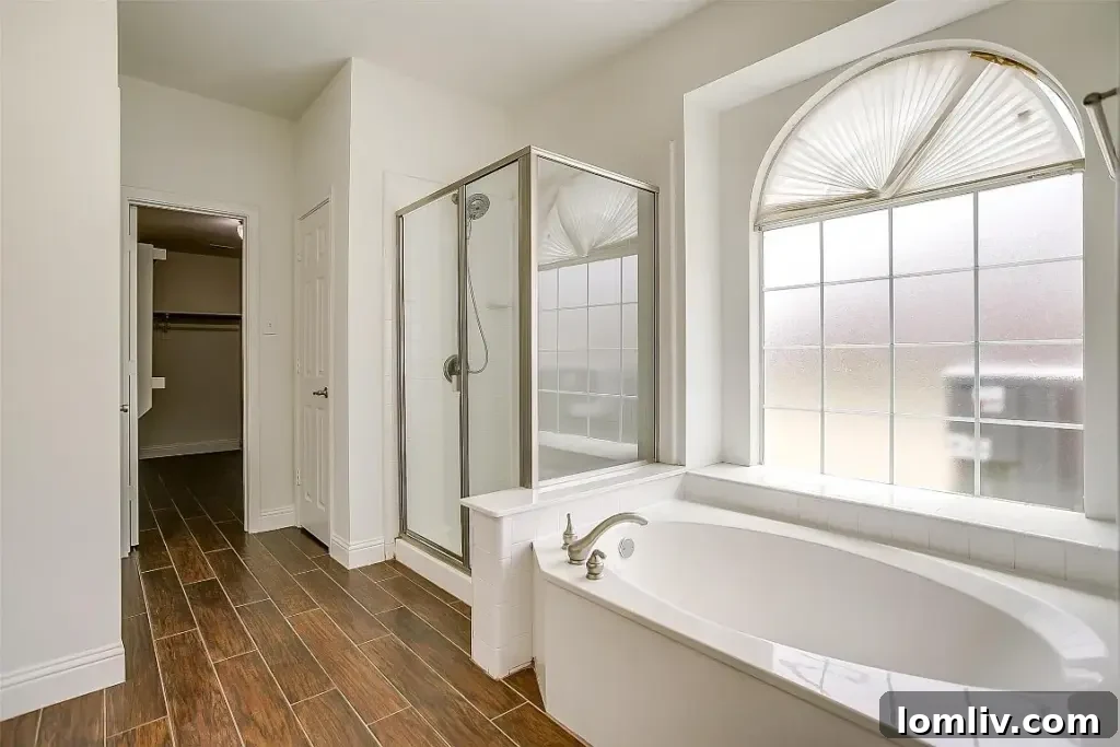 Luxurious master bathroom with modern vanity and large walk-in shower at 1505 Chateau Lane