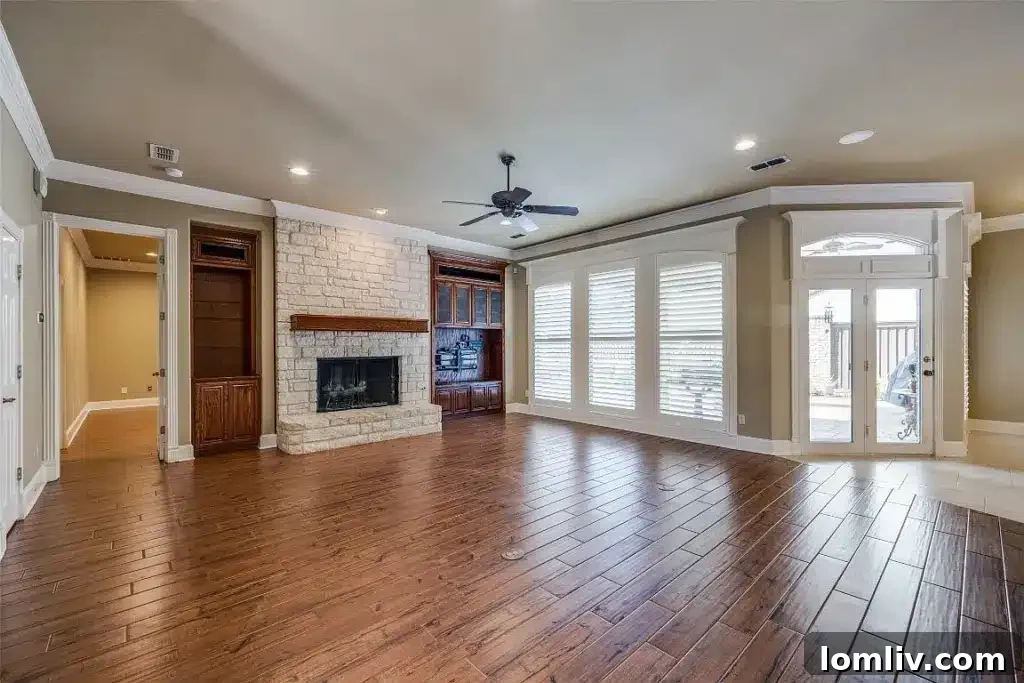Elegant living area with high ceilings and golf course views at 1305 Danbury Drive