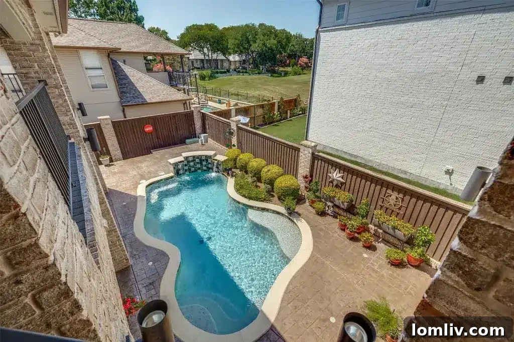 Stunning backyard with a pristine Pebbletech pool and views of the golf course at 1305 Danbury Drive