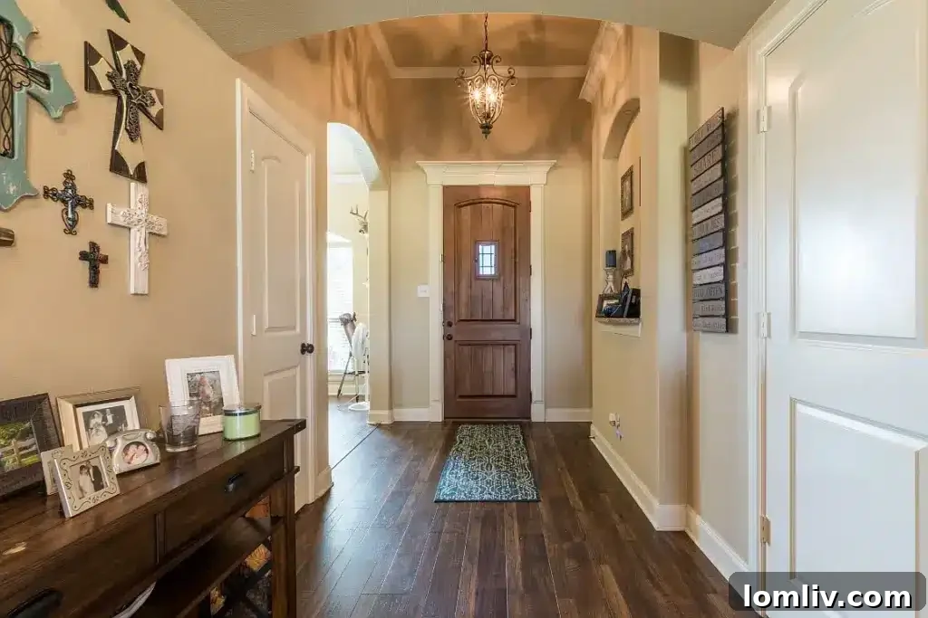 Spacious living room with fireplace and natural light at 7301 Granville Drive