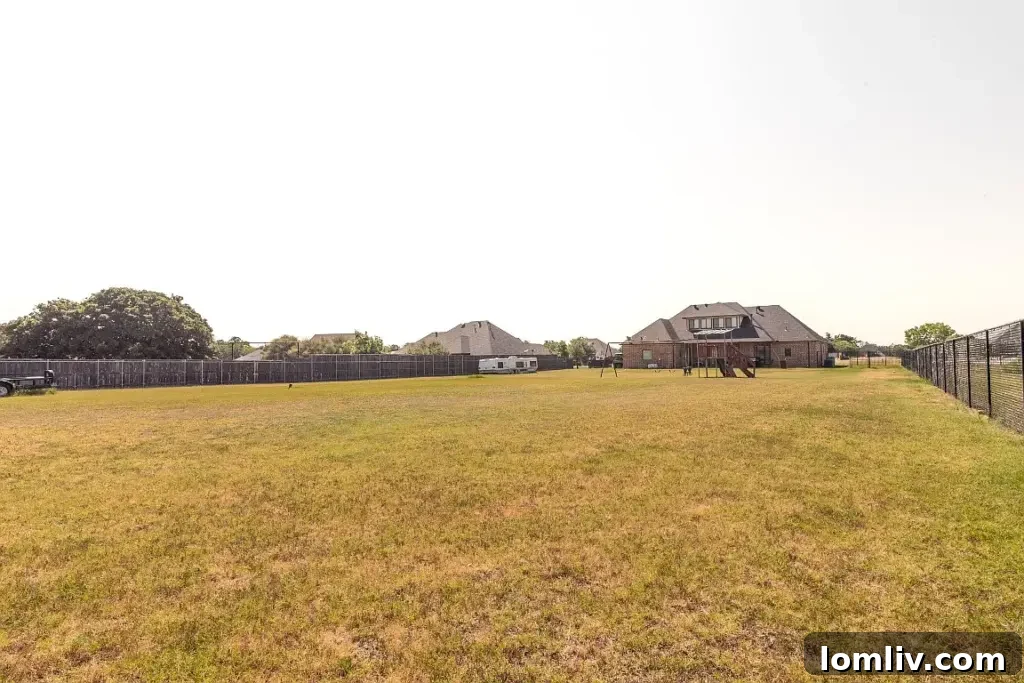 Expansive backyard with mature trees and vast open space at 7301 Granville Drive