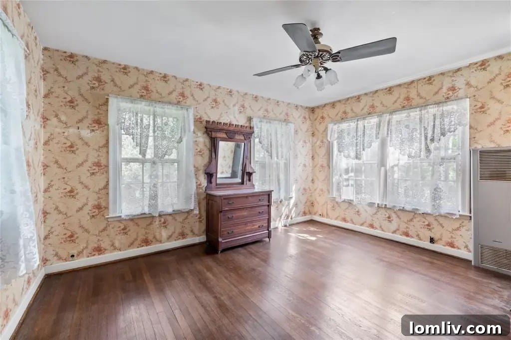 Another view of the kitchen, emphasizing its spaciousness and the original details that hint at its past.