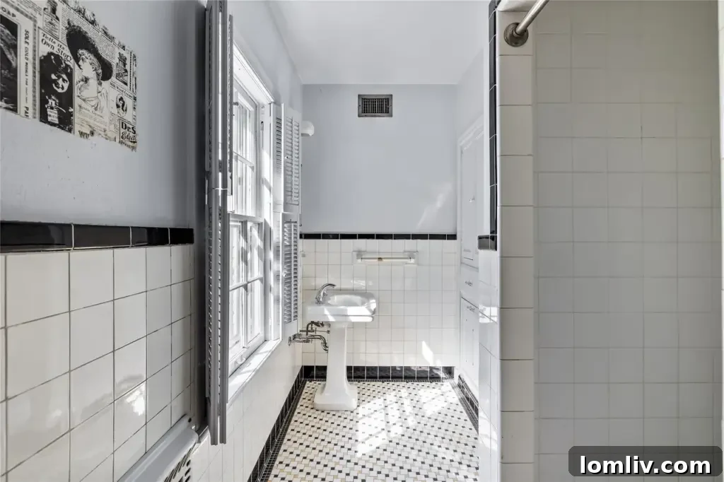 A classic bathroom with original tiling and fixtures, reflecting the enduring quality of the home's early construction.