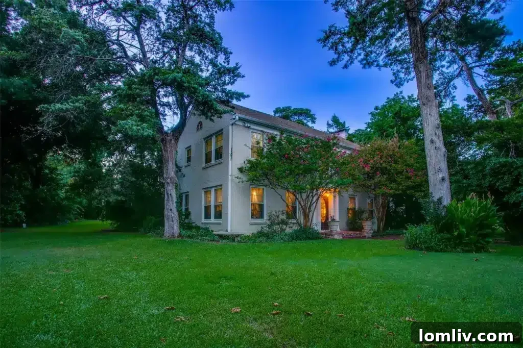 The impressive facade of the Plymouth Road home, showing its colonial architecture and spacious front yard after extensive clearing.