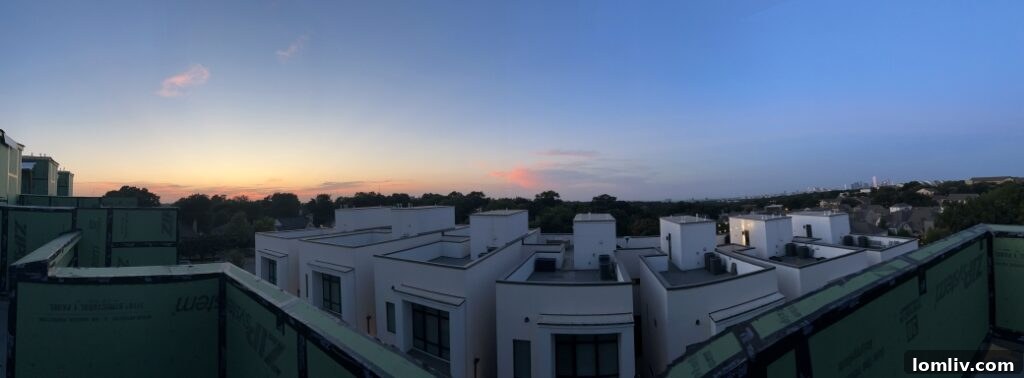 Spacious living room with large windows, offering abundant natural light and modern comfort.