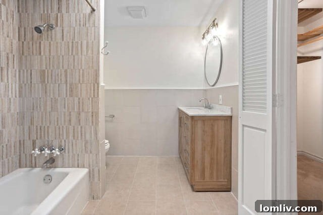 Recently updated bathroom with modern tile and fixtures in a Fort Worth bungalow