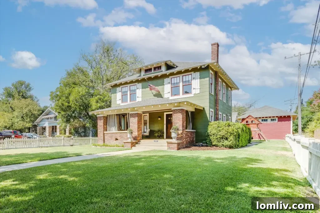 Fort Worth Craftsman A Colorful Renovation Fueled by Love 11 Expansive backyard with lush greenery and restored historic home facade