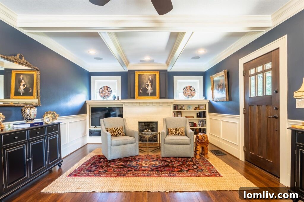 Fort Worth Craftsman A Colorful Renovation Fueled by Love 4 Elegant living room with restored wood floors and vintage fireplace in Fort Worth